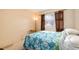Cozy bedroom with a comfortable bed, soft lighting, and a large window at 7755 E Quincy Ave # T80, Denver, CO 80237
