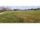 Expansive green athletic field in a parklike setting with city skyline in background on a clear day at 7755 E Quincy Ave # T80, Denver, CO 80237