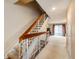 Bright stairway hallway leading to a spacious living room and outdoor view at 7755 E Quincy Ave # T80, Denver, CO 80237