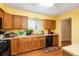 Well-lit kitchen features ample counter space, modern appliances, and wood flooring at 7755 E Quincy Ave # T80, Denver, CO 80237