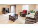 Cozy living room features natural light, neutral carpets, and comfortable seating at 7755 E Quincy Ave # T80, Denver, CO 80237