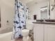 Bright bathroom featuring a tiled tub and shower, a modern vanity, and plenty of storage at 8114 Gray Ct # 478, Arvada, CO 80003