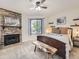 Relaxing main bedroom with stone fireplace, decorative shelves and a cozy sitting bench at 8114 Gray Ct # 478, Arvada, CO 80003