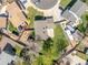 Bird's-eye view of the house in a neighborhood, showcasing the layout, gardens, and surroundings at 7367 Coors St, Arvada, CO 80005