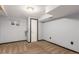 Basement bedroom with carpet floors and an egress window, offers great space and light at 7367 Coors St, Arvada, CO 80005