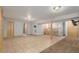 Spacious basement featuring tile flooring and a built-in bar, perfect for entertaining at 7367 Coors St, Arvada, CO 80005