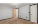 Basement bedroom with carpet floors, egress window, and a closet space at 7367 Coors St, Arvada, CO 80005