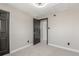 Bright bedroom features neutral walls and carpet, with a closet, ready for personalized decor at 7367 Coors St, Arvada, CO 80005
