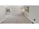 Bright living room featuring neutral carpet, large windows, and access to other rooms at 7367 Coors St, Arvada, CO 80005