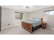 The primary bedroom features natural light, a ceiling fan, and neutral colors at 7367 Coors St, Arvada, CO 80005