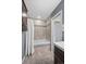 Bathroom highlighting a tiled tub with shower curtain and decorative tile work at 7409 Mount Meeker Rd, Longmont, CO 80503