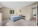 Comfortable bedroom with a large window, carpet, and charming decor at 7409 Mount Meeker Rd, Longmont, CO 80503