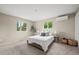 Spacious bedroom featuring natural light from large windows and neutral decor at 7409 Mount Meeker Rd, Longmont, CO 80503