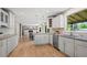 Open-concept kitchen featuring stainless steel appliances, granite countertops, and sight lines to the Gathering room at 7409 Mount Meeker Rd, Longmont, CO 80503