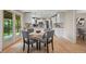 Eat-in kitchen features white cabinets, stainless steel appliances, and a sliding door to the backyard at 7409 Mount Meeker Rd, Longmont, CO 80503