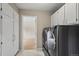 Laundry room featuring washer, dryer, and built-in storage cabinets at 7409 Mount Meeker Rd, Longmont, CO 80503