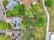 An aerial view of the property shows a well maintained home, landscaping and proximity to a park at 12355 E Arkansas Pl, Aurora, CO 80012