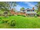An expansive lawn, complemented by the house's architecture, ensures a harmonious blend of space and style at 12355 E Arkansas Pl, Aurora, CO 80012