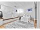 Basement bedroom with white painted brick, wood-look floors, and custom bench at 12355 E Arkansas Pl, Aurora, CO 80012