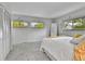 Cozy bedroom featuring carpeted floors, natural light, and closet space at 12355 E Arkansas Pl, Aurora, CO 80012
