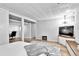 Basement bedroom with TV area, wood-look floors, and neutral wall colors at 12355 E Arkansas Pl, Aurora, CO 80012