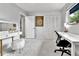 Spacious bedroom with a vanity, a work desk, and a decorative 