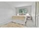 Cozy bedroom with a soft rug, comfortable bed, and natural light from the window at 12355 E Arkansas Pl, Aurora, CO 80012