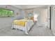 Bedroom features carpeted floors, natural light, and closet space at 12355 E Arkansas Pl, Aurora, CO 80012