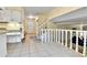 Entryway features tile flooring, staircase, and access to the kitchen and front door at 12355 E Arkansas Pl, Aurora, CO 80012