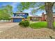 Charming home with stone and manicured grass in the front yard at 12355 E Arkansas Pl, Aurora, CO 80012