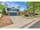 Charming two-story home with a well-manicured front yard and a spacious driveway at 12355 E Arkansas Pl, Aurora, CO 80012