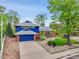 Charming two-story home with a well-manicured front yard and a painted blue trim at 12355 E Arkansas Pl, Aurora, CO 80012
