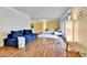 Bright and airy living room featuring hardwood floors and a cozy seating area at 12355 E Arkansas Pl, Aurora, CO 80012