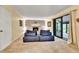 Inviting living room with a brick fireplace and comfortable blue modular seating at 12355 E Arkansas Pl, Aurora, CO 80012