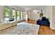 Cozy living room features hardwood floors, a plush white rug, and natural light at 12355 E Arkansas Pl, Aurora, CO 80012