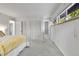Spacious main bedroom with carpeted floors, natural light, and closet space at 12355 E Arkansas Pl, Aurora, CO 80012