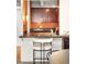 Kitchen pass-through with breakfast bar seating and pendant lighting at 1365 Columbine St # 301, Denver, CO 80206
