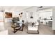 Open floor plan living room with modern furnishings and a glimpse into the office area at 1365 Columbine St # 301, Denver, CO 80206