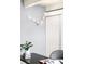 A decorative gold light fixture highlights the desk area of a home office at 1365 Columbine St # 301, Denver, CO 80206