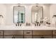 Elegant bathroom features double sinks, modern lighting, and sleek wood cabinetry at 7998 S Wabash Ct, Centennial, CO 80112