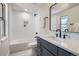 Modern bathroom boasts stylish vanity, sleek fixtures, and tub-shower combo at 7998 S Wabash Ct, Centennial, CO 80112