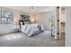 Bright bedroom features neutral tones, a ceiling fan, and large windows that let in plenty of natural light at 7998 S Wabash Ct, Centennial, CO 80112