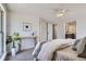 Well-lit bedroom features an open layout and includes a glimpse of an ensuite bathroom at 7998 S Wabash Ct, Centennial, CO 80112