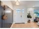 Bright foyer with hardwood floors, a coat rack, and a view into the living space at 7998 S Wabash Ct, Centennial, CO 80112