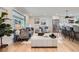 Open-concept living area with hardwood floors, large windows, and modern decor at 7998 S Wabash Ct, Centennial, CO 80112