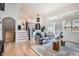 Living room with hardwood floors, modern furniture, and an open floor plan at 7998 S Wabash Ct, Centennial, CO 80112