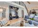 Open-concept living room with modern decor, built-ins, and hardwood flooring at 7998 S Wabash Ct, Centennial, CO 80112