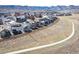 Scenic aerial of new houses backing up to paved walking path and mountain views at 8346 Mount Kataka St, Littleton, CO 80125