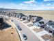 Aerial view of a suburban street with two story homes, driveways, and landscaping in a planned community at 8346 Mount Kataka St, Littleton, CO 80125