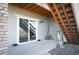 Back patio with concrete flooring with stairs and sliding glass door looking out to open space at 8346 Mount Kataka St, Littleton, CO 80125